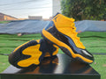 Air Jordan 11 Sneakers – Orange, Yellow & Black